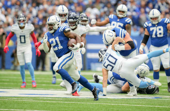 Oct 8, 2023; Indianapolis, Indiana, USA; Indianapolis Colts running back Zack Moss (21) rushes the ball for a touchdown during a game against the Tennessee Titans at Lucas Oil Stadium.